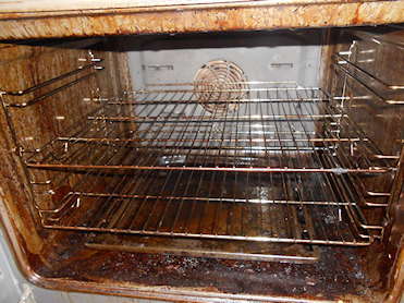 Oven being cleaned